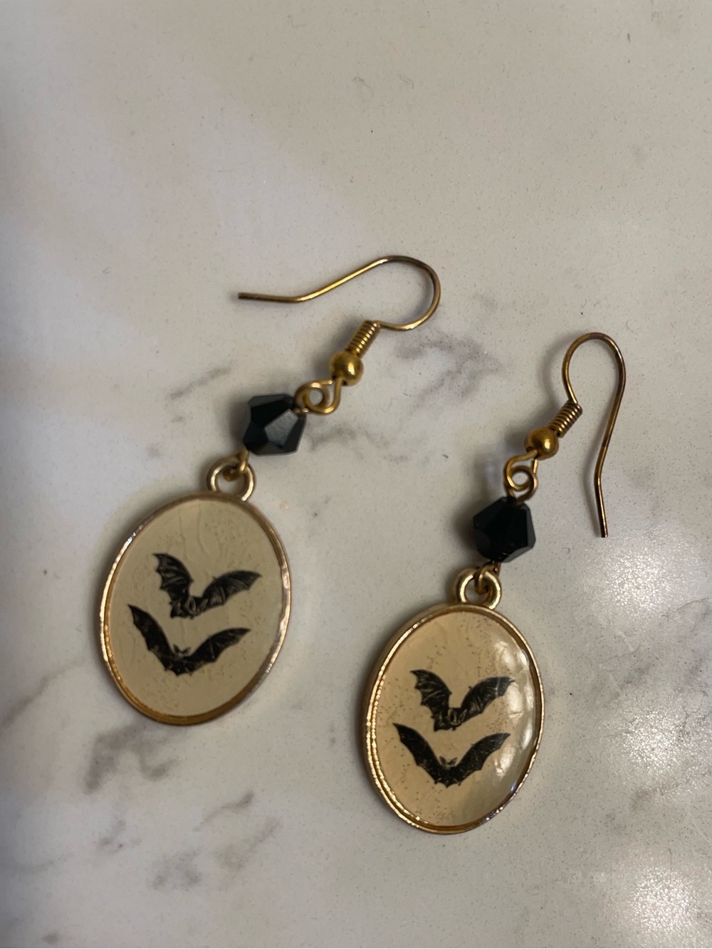 Gold Moonlit Bat Drop Earrings with Black Bead Accent